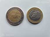 Монеты 2 и 1 евро с буквой S - MM.LV