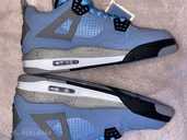 Новые неношеные Nike air Jordan 4 University Blue Retro - MM.LV